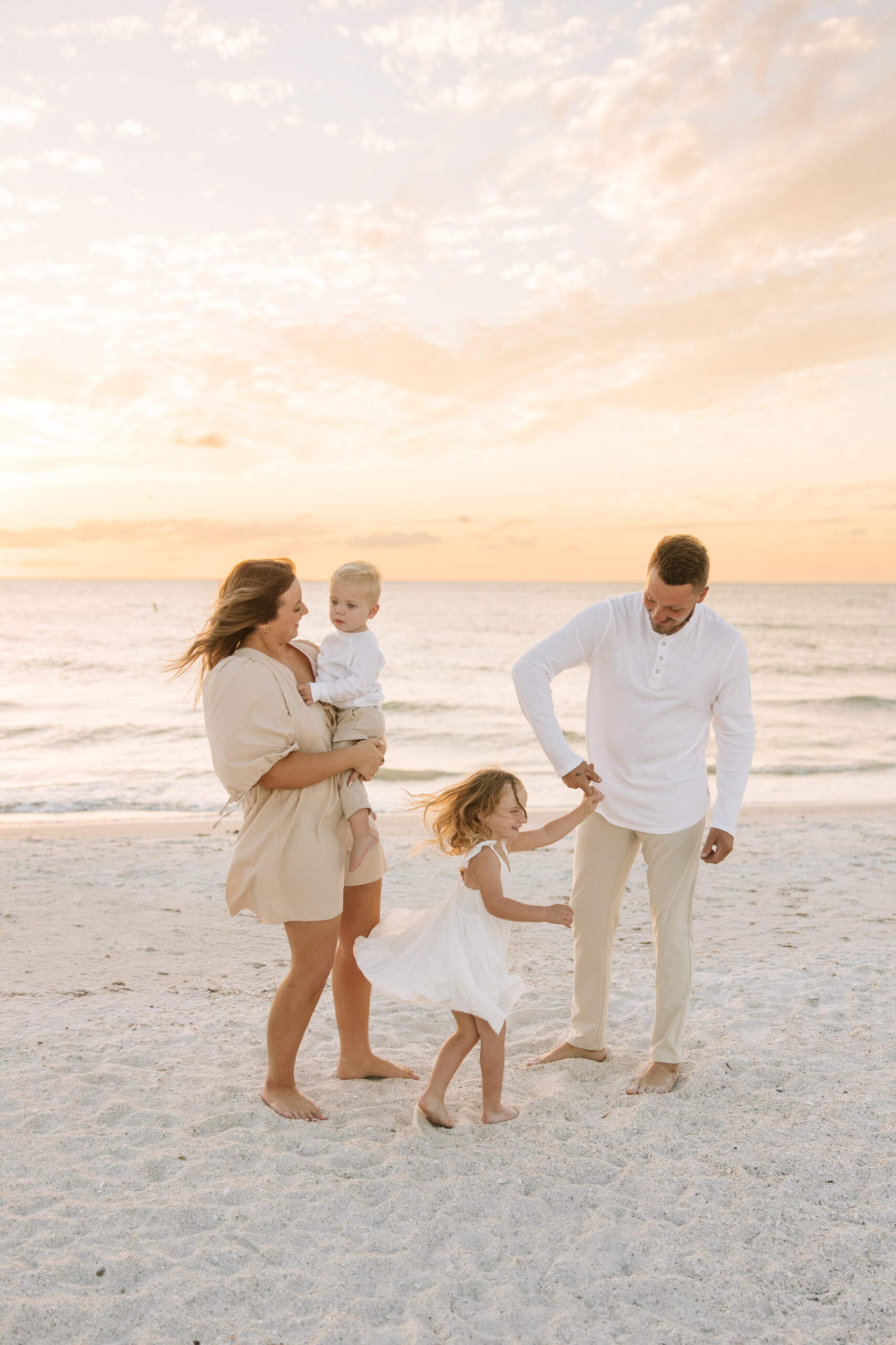 Family on St Pete Beach playing at sunset