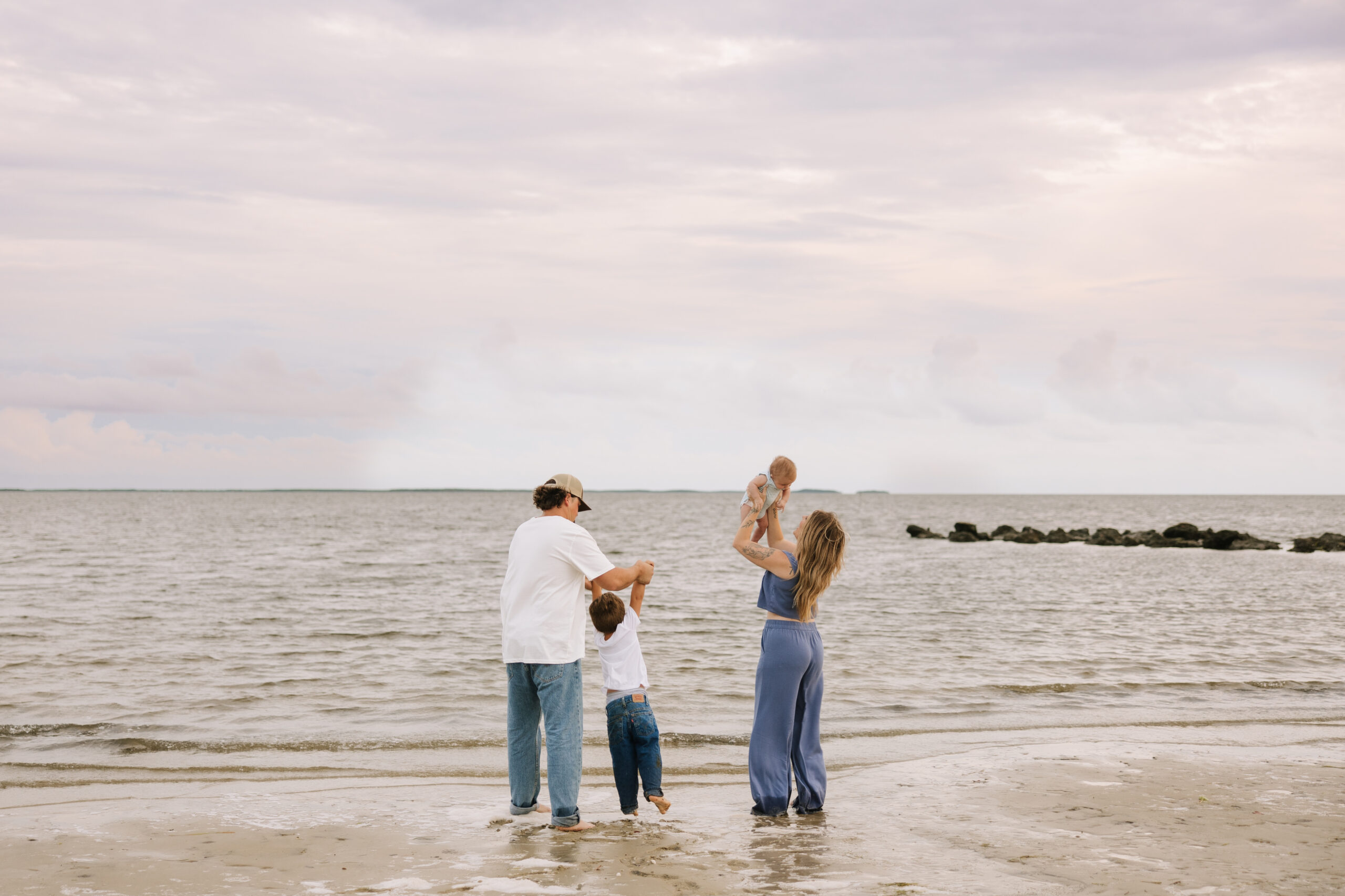 family playing on crystal river beach